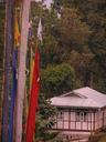 Hillside home and prayer poles.